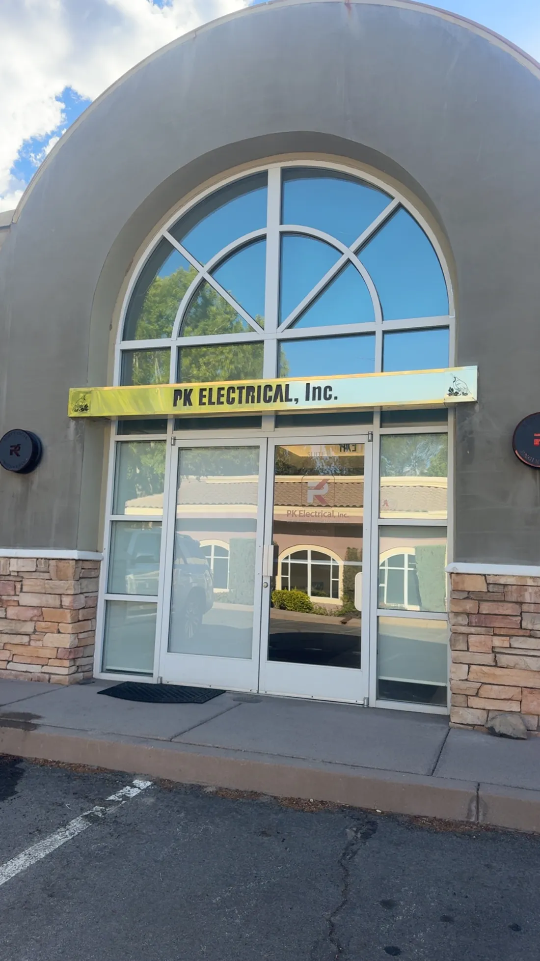 Sparkling clean arched commercial entry glass after a Squatch cleaning