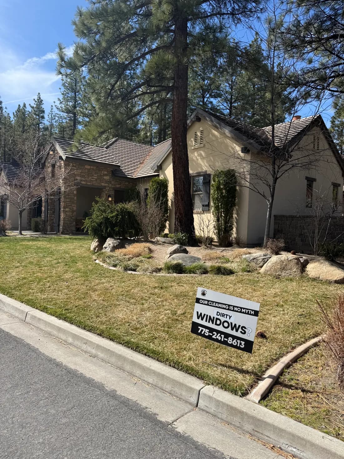 Squatch Window Cleaning yard sign in front of a Reno home